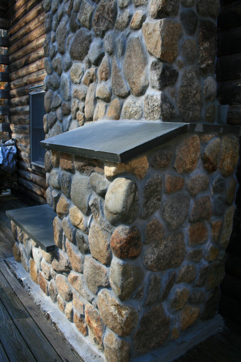 Field stone veneer exterior of chimney